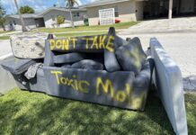 a couch that is sitting in the grass