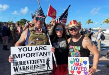 IRREVERENT WARRIORS USE HUMOR TO STEM SUICIDE IN VETERANS a group of people standing next to each other holding signs