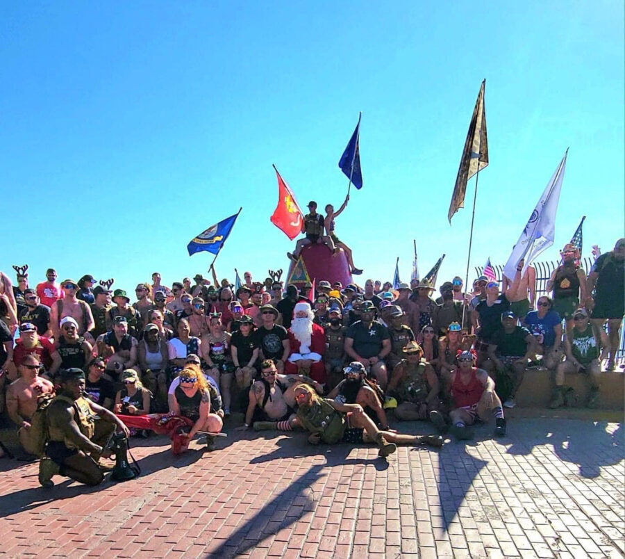 a large group of people sitting on the ground