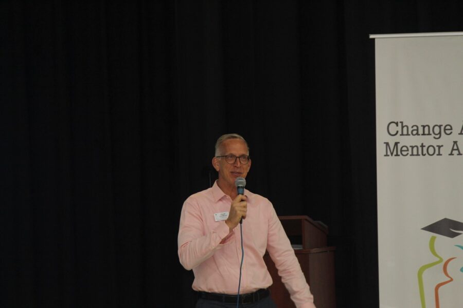 a man standing in front of a microphone