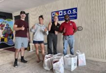 a group of people standing in front of a building