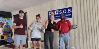 a group of people standing in front of a building