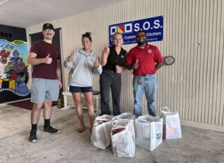a group of people standing in front of a building