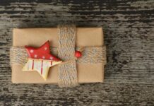 UNWRAPPING HOLIDAY WASTE: TIPS TO KEEPING THE FLORIDA KEYS GREEN a present wrapped in brown paper with a star decoration