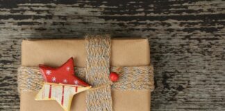 a present wrapped in brown paper with a star decoration