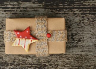 a present wrapped in brown paper with a star decoration