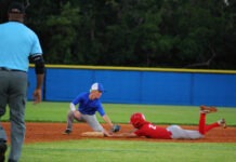 GAME-READY: KEYS BASEBALL PROGRAMS USE FALL BALL TO STAY SHARP a baseball player sliding into a base during a game
