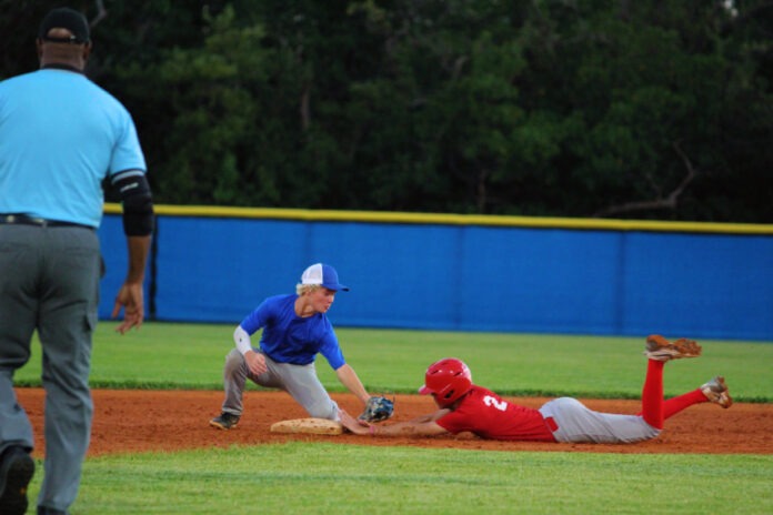 a baseball player sliding into a base during a game