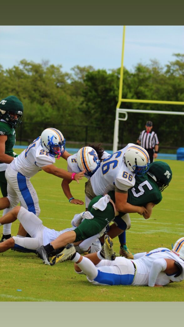 a group of young men playing a game of football