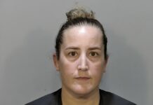 PROSECUTORS TO SEEK PRISON FOR FORMER DEPUTY a mug shot of a woman in a black shirt