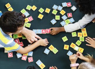 a group of children playing with letters and numbers