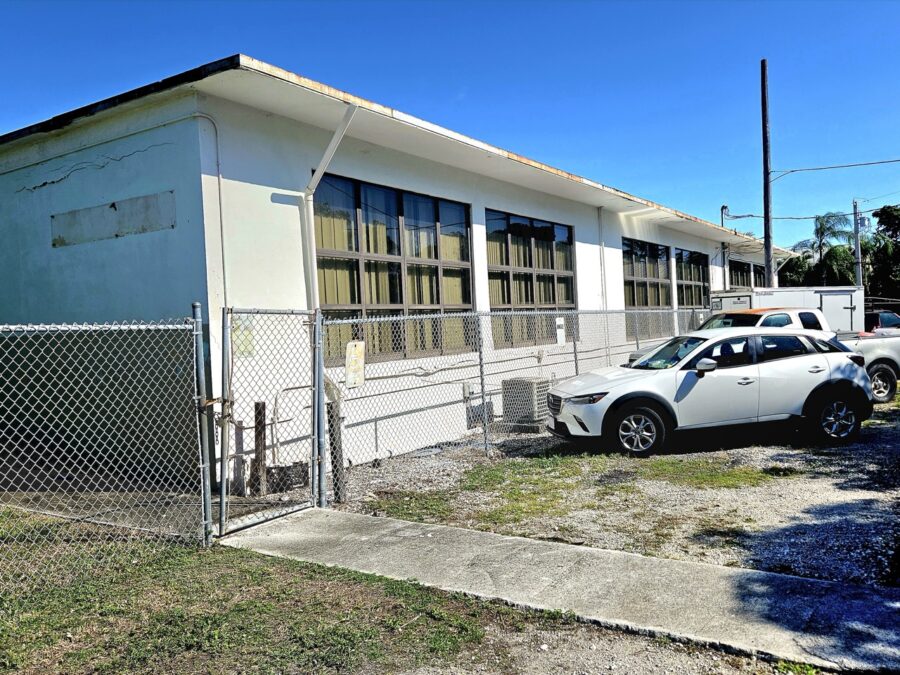 two cars parked in front of a building