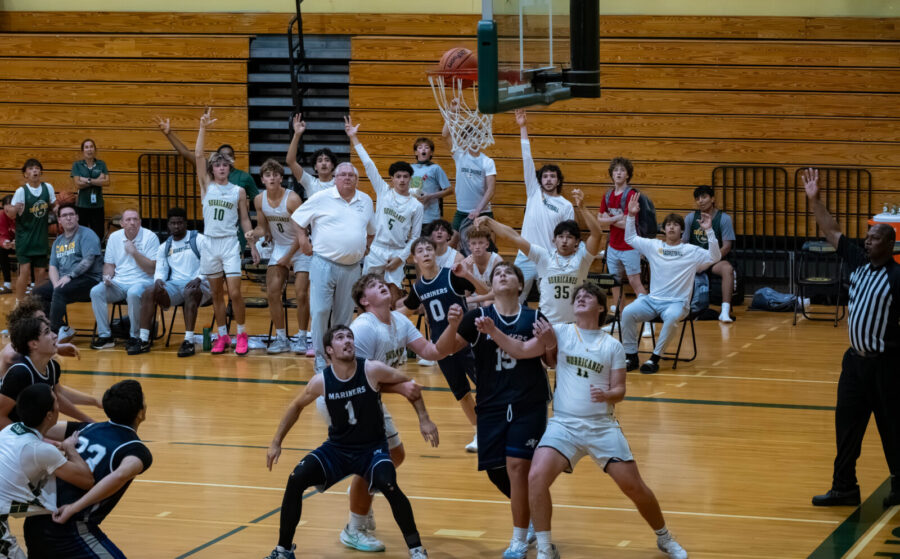 a group of young people playing a game of basketball