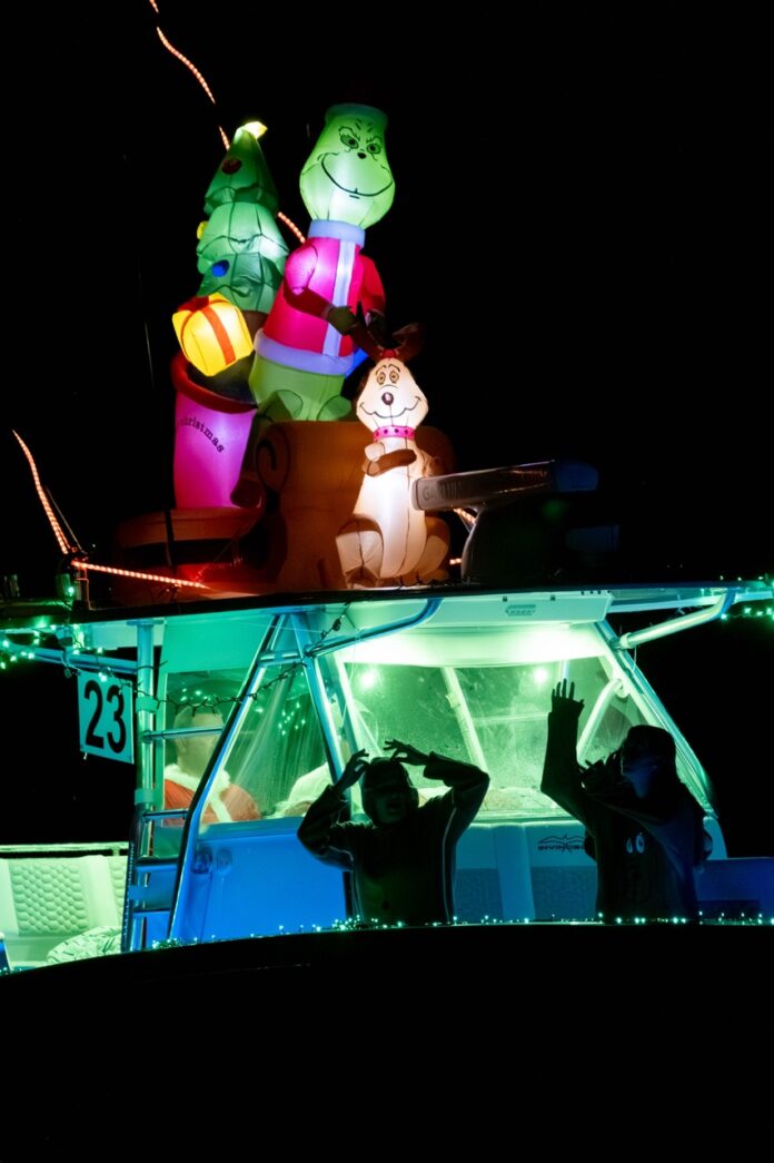 a couple of people standing on top of a boat