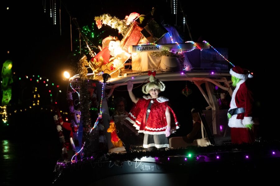 a boat decorated with christmas lights and decorations