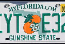 IS YOUR LICENSE PLATE FRAME LEGAL? CLEARING UP THE CONFUSION a license plate with a picture of an orange on it