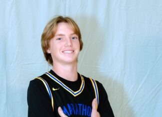 ATHLETE OF THE WEEK: JACK CHAPMAN a young man in a black shirt holding a basketball ball