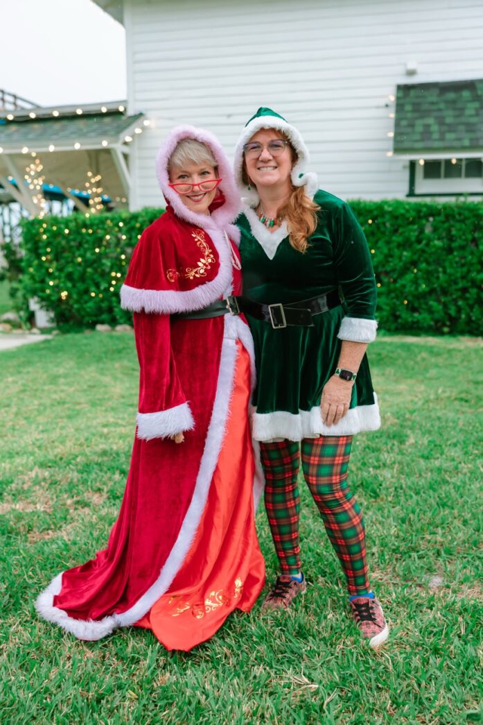 two women dressed as santa claus and mrs claus
