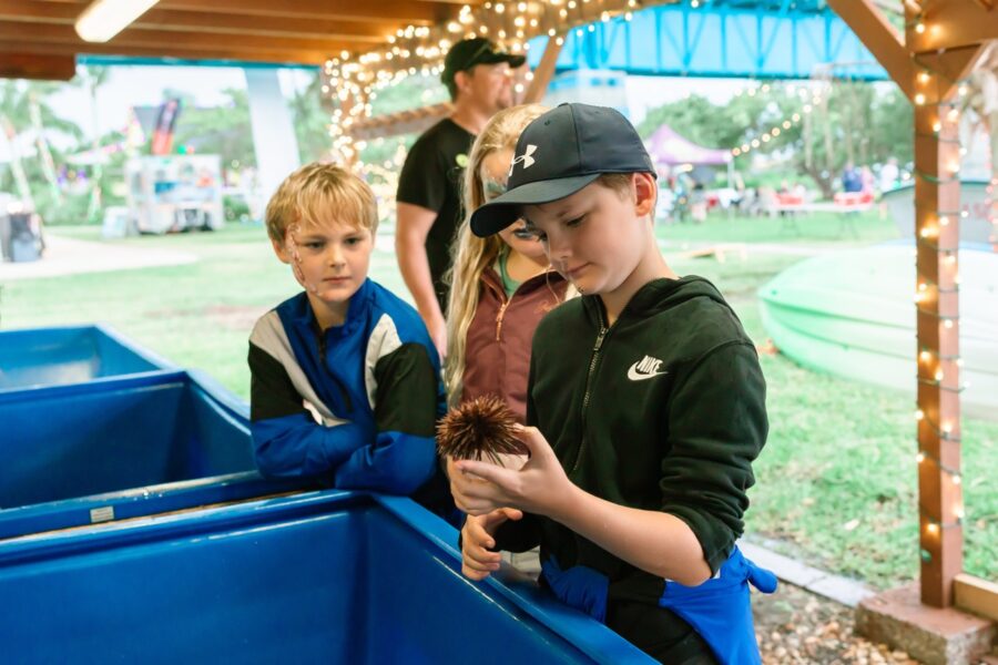 a group of young boys standing next to each other