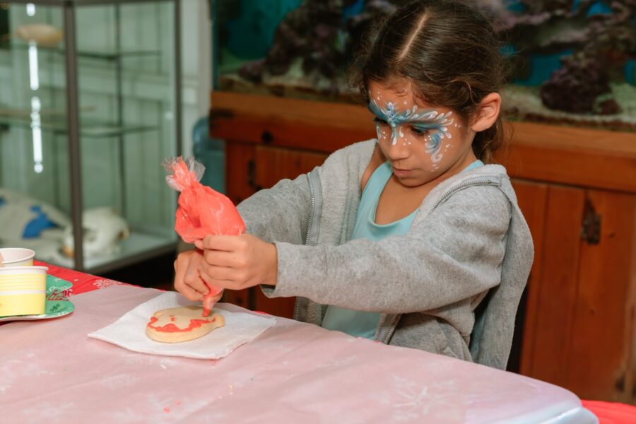 a little girl with face paint on her face