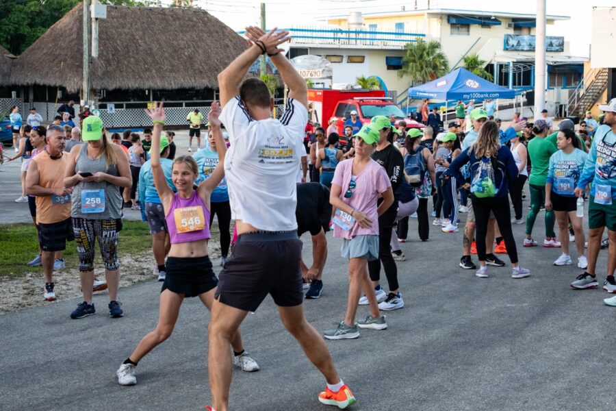 a group of people standing on top of a street
