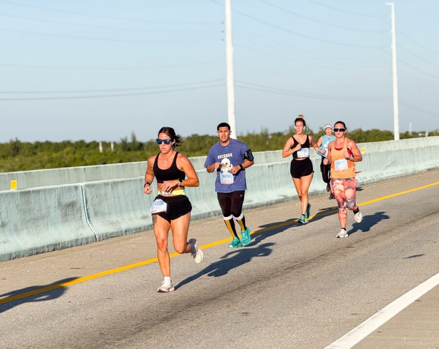 a group of people running down a road
