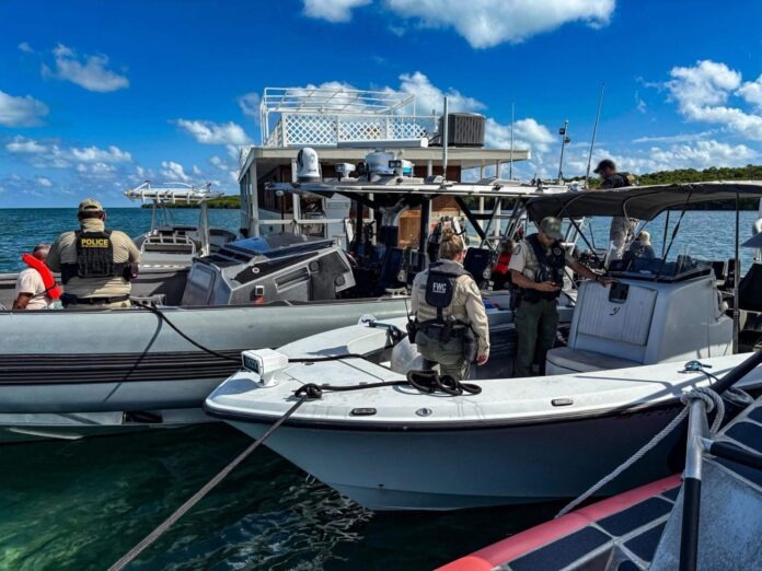 CBP water opeation a group of people standing on a boat in the water