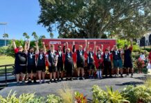 a group of people standing on top of a stage