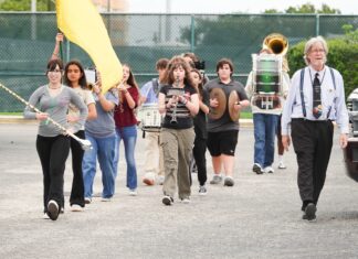 a group of people walking down a street