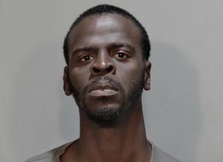 a man is shown in a mug shot