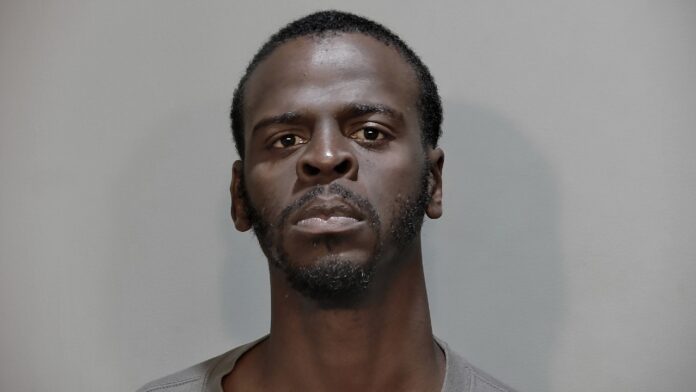 a man is shown in a mug shot