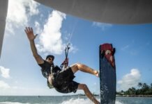 a man riding a wake board on top of a body of water