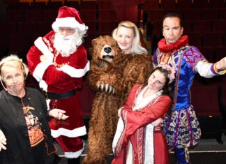 RED BARN THEATRE’S HOLIDAY COMEDY BLENDS SHAKESPEARE WITH DICKENS a group of people dressed up as santa claus