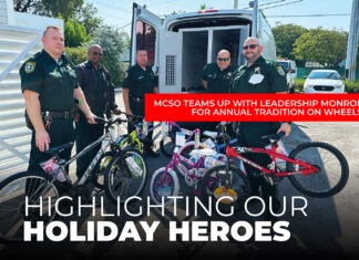 FULL-CIRCLE GIVING: MCSO TEAMS UP WITH LEADERSHIP MONROE FOR ANNUAL TRADITION ON WHEELS a group of men standing next to each other