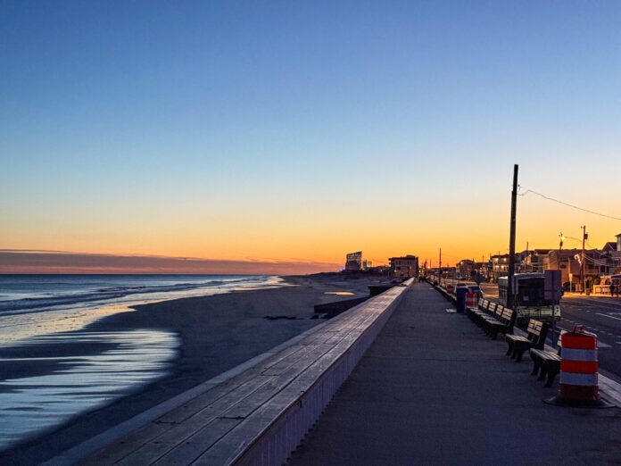 Hedden. Brigantine Sunset a view of a beach at sunset from a boardwalk