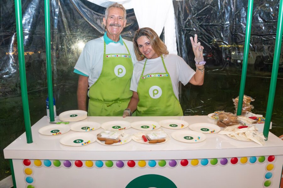 a man and a woman standing in front of a table