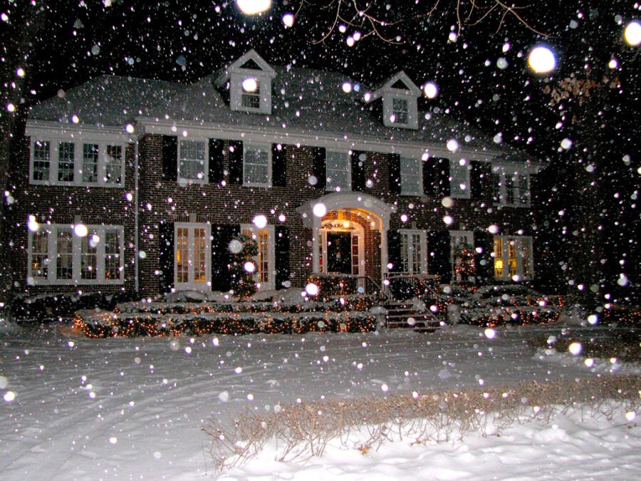 a large house covered in snow at night