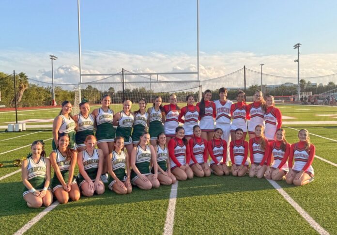 a group of women's soccer players posing for a team photo