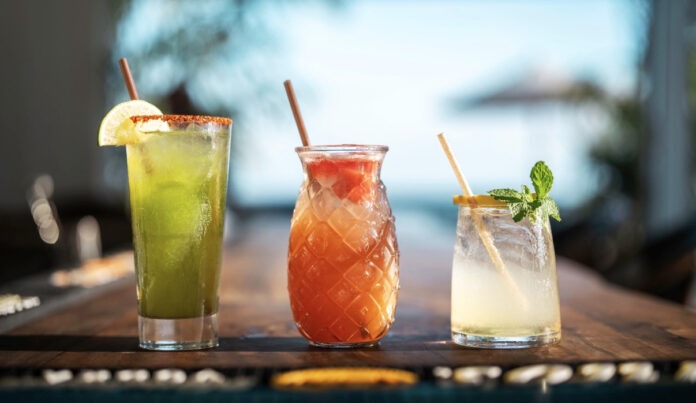 three different types of drinks sitting on a table