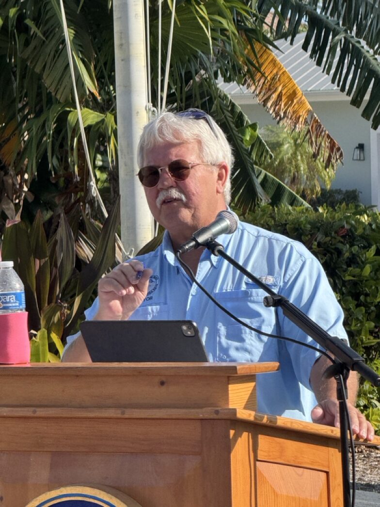 a man standing at a podium giving a speech