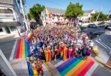 a large group of people standing on a street