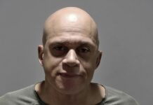 MIAMI BEACH MAN CHARGED FOLLOWING REPORTED ROAD RAGE INCIDENT ON STOCK ISLAND a man with a bald head wearing a gray shirt