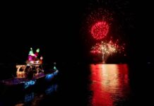 KEY LARGO’S BLACKWATER SOUND TURNS FESTIVE — AND LIT a boat in the water with a lot of fireworks in the sky