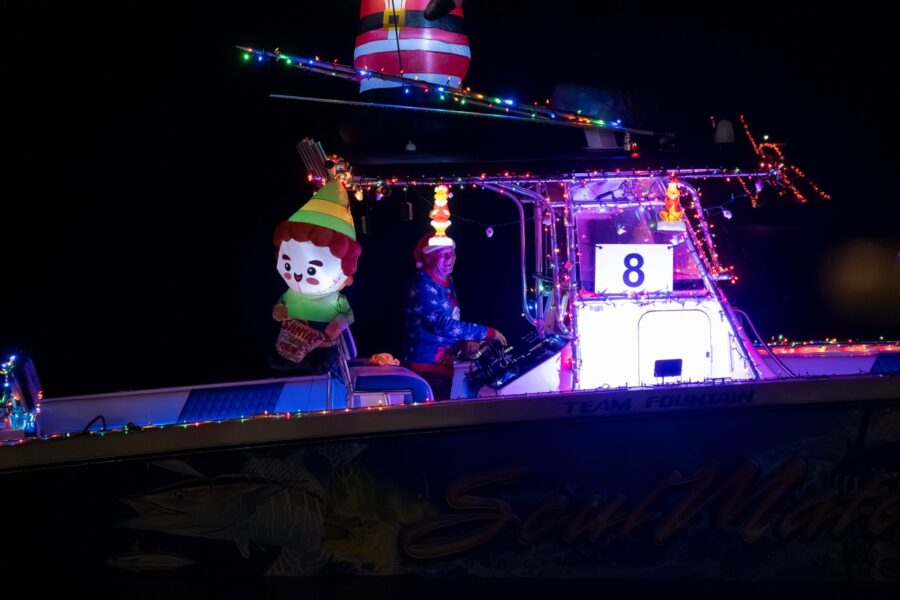a boat decorated with christmas lights and decorations