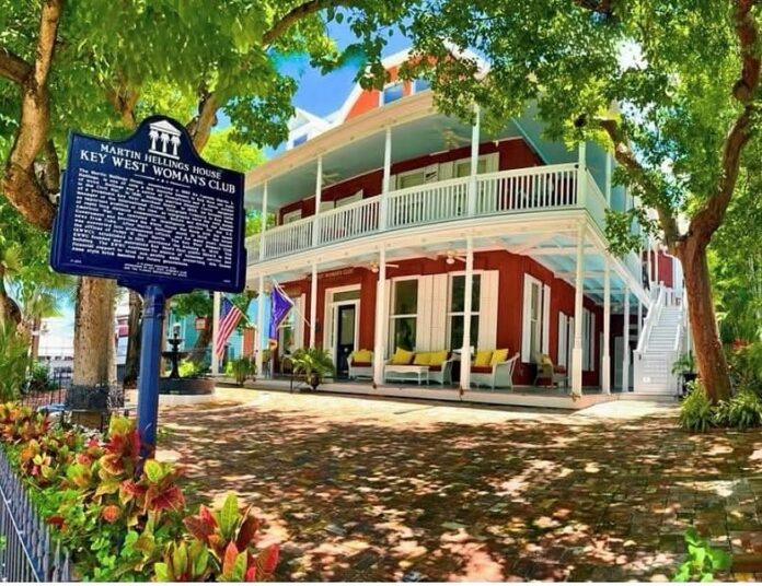 KW WOman_s Club a red and white house with a sign in front of it