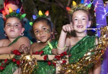 KEY WEST HOLIDAY PARADE SPARKLES & SNOWS a group of young children dressed in costumes
