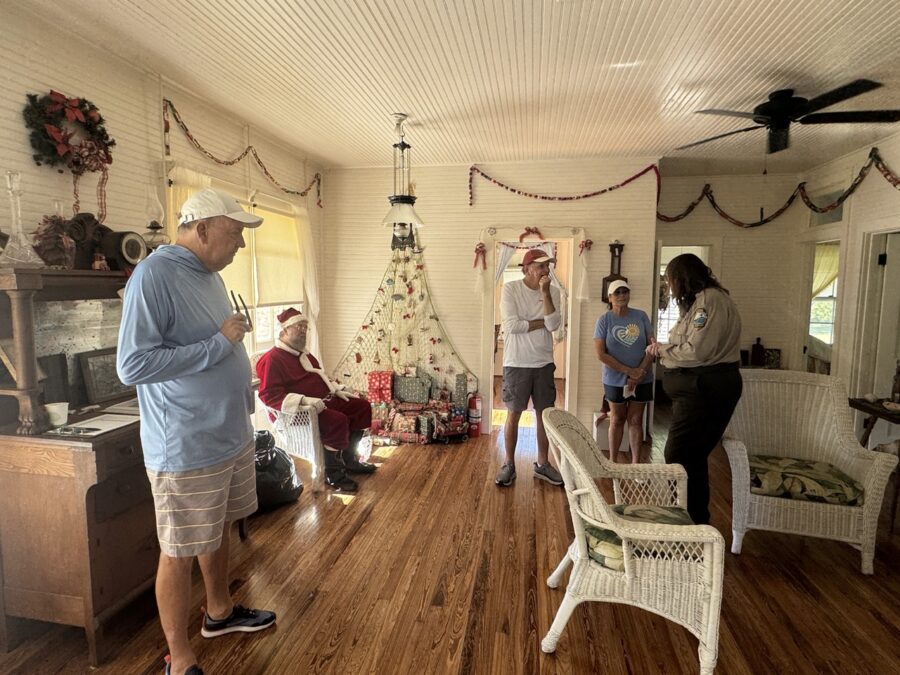 a group of people standing in a living room