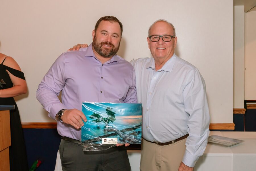 a couple of men standing next to each other