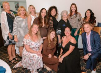 a group of women posing for a picture together