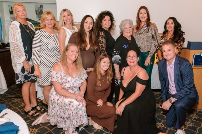 a group of women posing for a picture together